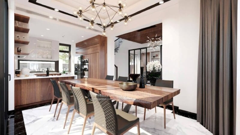 Ngoài điểm đặc biệt từ cách bố trí kệ trang trí, bàn đảo bằng đá nhân tạo màu trắng được thiết kế phô ra ngoài lại là điểm đáng chú ý, một mặt vẫn đảm bảo diện tích để chủ nhân có thể phô diễn món ăn thỏa mái, một mặt bạn lại có thể vừa nội trợ vừa có thể để mắt con học một cách dễ dàng. Đá ốp bếp biệt thự