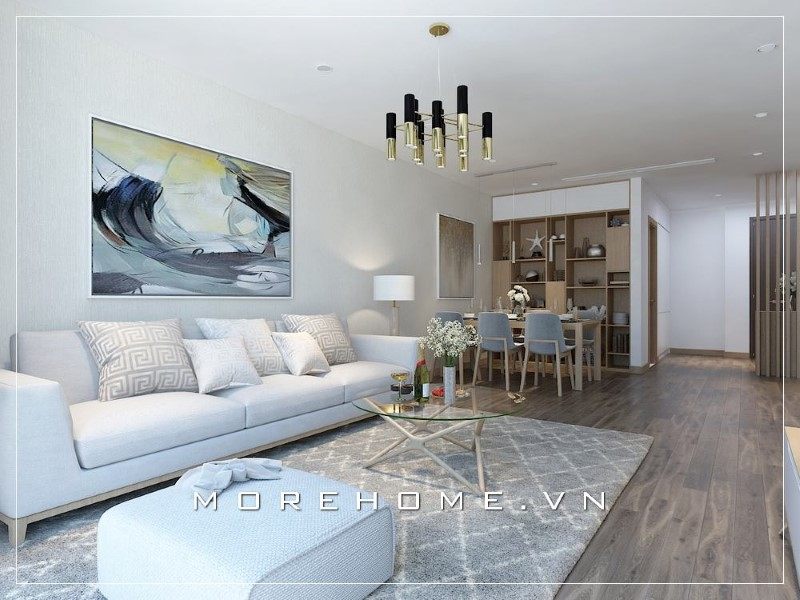 Ghế sofa trong phòng khách có màu sáng làm nền tạo nên sự hài hòa khi kết hợp với bàn trà hiện đại, góp phần tạo nên sự đẹp cho cả thiết kế của phòng.